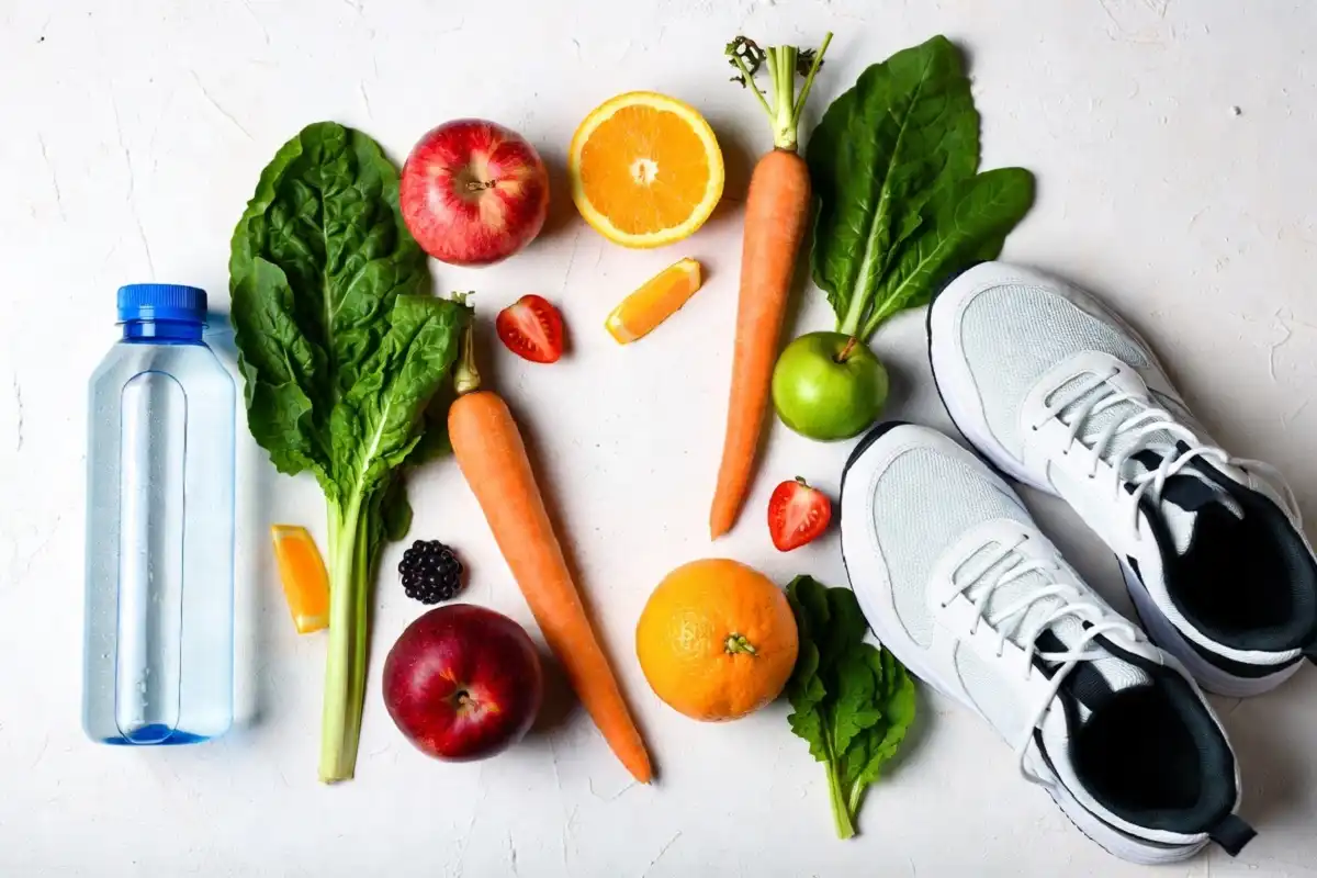Whole foods, water, and shoes showing a balanced healthy lifestyle