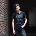 Emo fashion style overview featuring dark clothing band tees and layered accessories