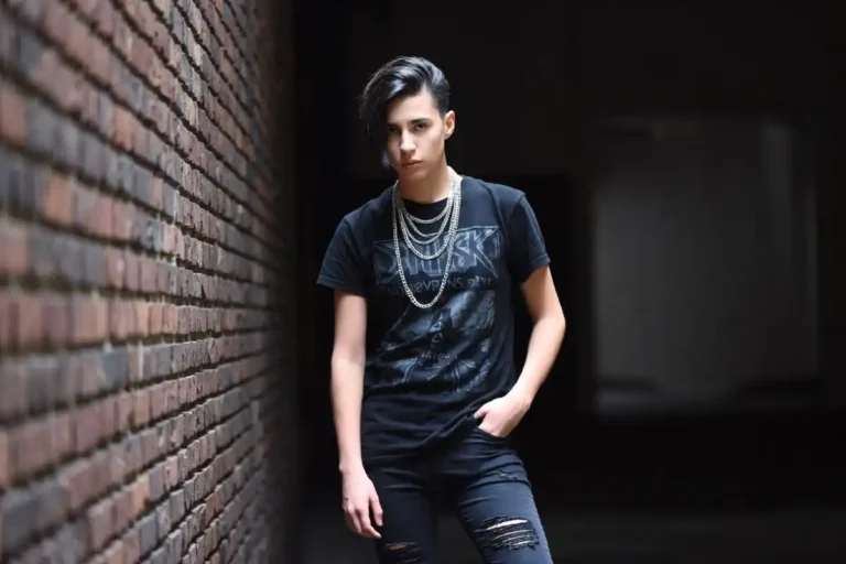 Emo fashion style overview featuring dark clothing band tees and layered accessories