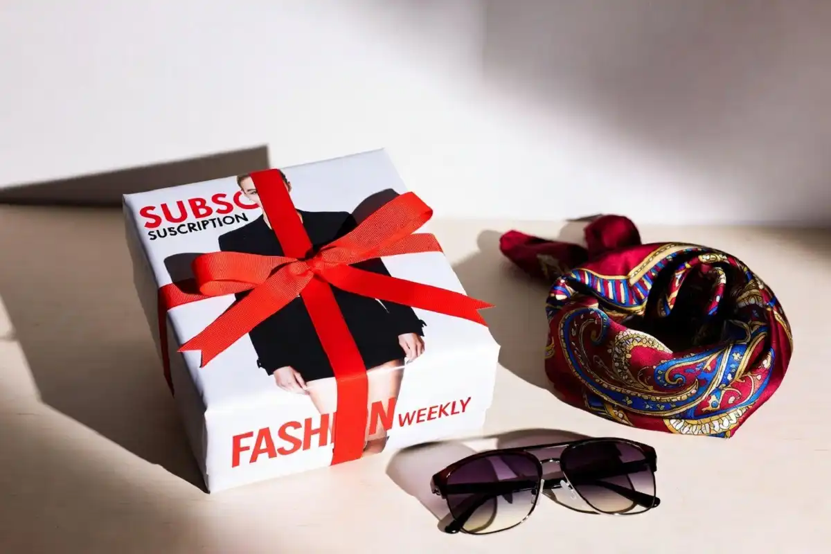 Wrapped fashion magazine subscription gift box with ribbon for a style lover