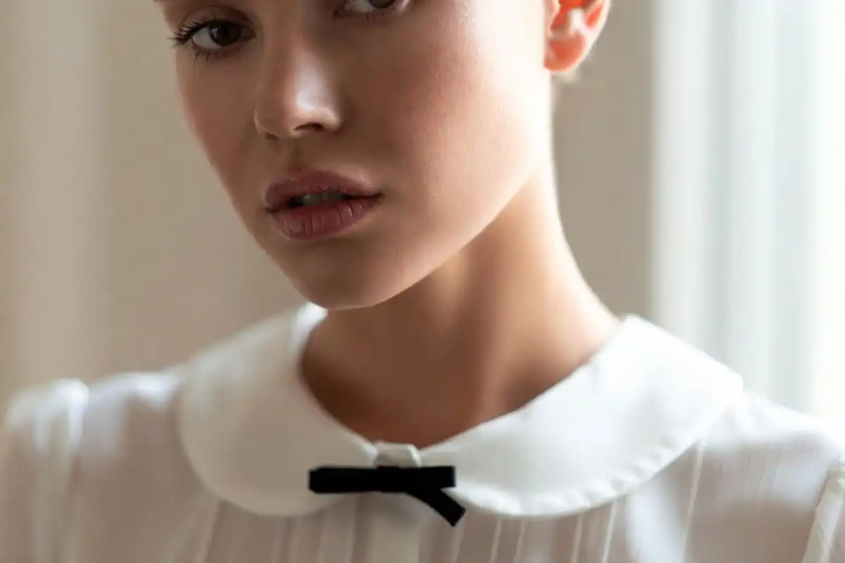 Close-up of a Peter Pan collar blouse with bow detail