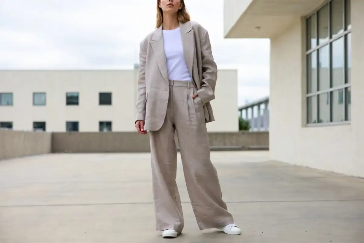 Model wearing a relaxed tailored blazer and wide-leg trousers representing 2024 fashion trends