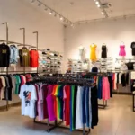 Colorful Viva Fashion store interior showing urban streetwear clothing displays and accessories