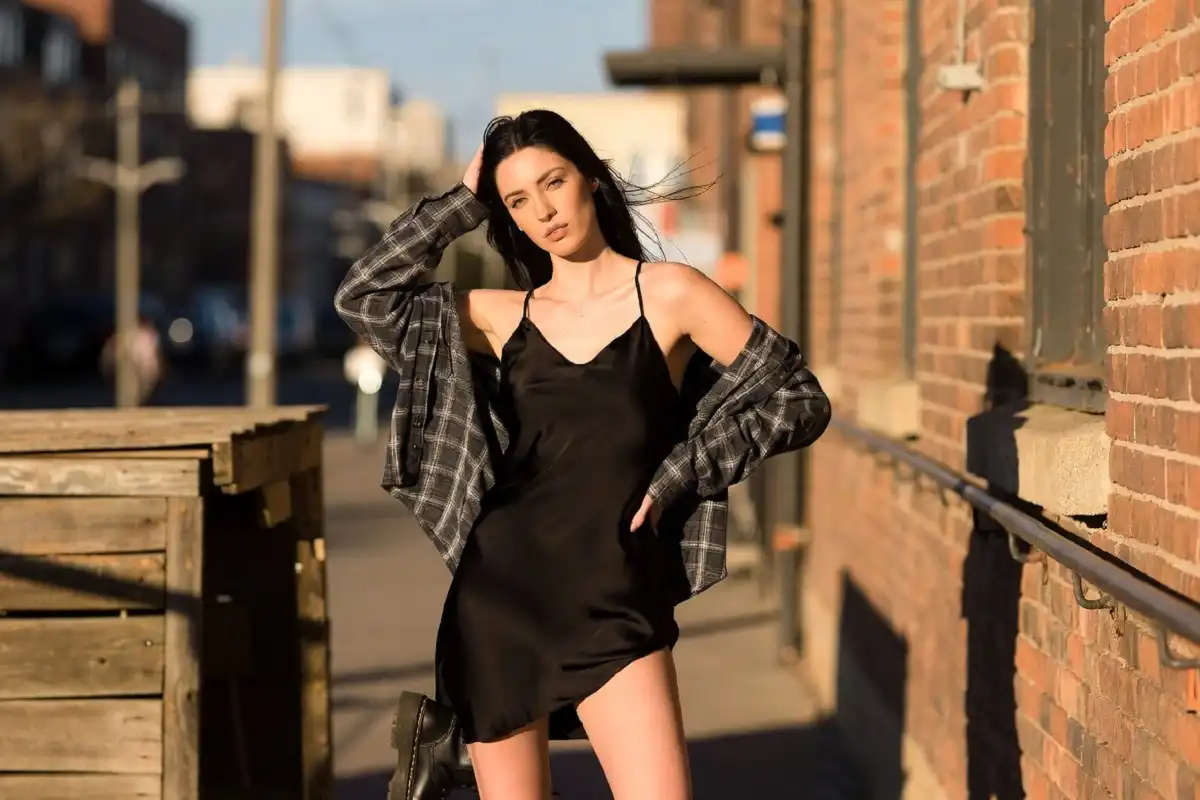 Women's 90s grunge fashion with slip dress and boots