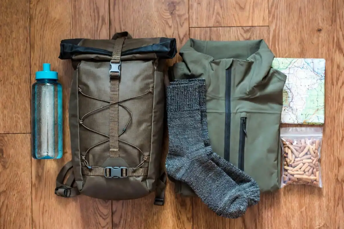 Flat lay of budget hiking essentials laid out for a day hike